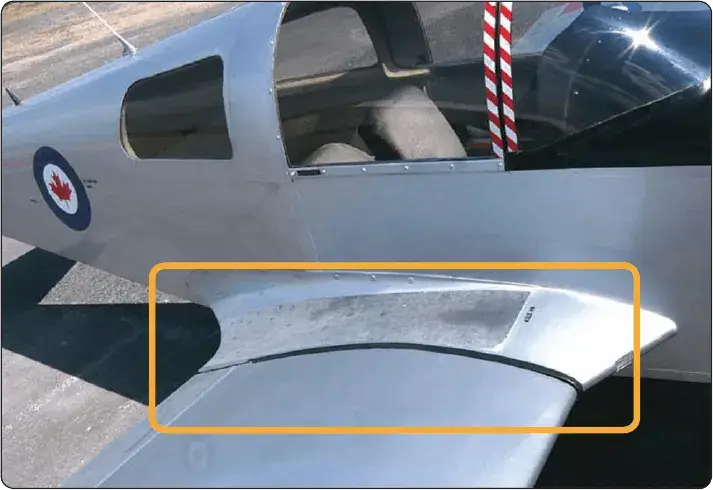 Aircraft wing root fairing smoothing airflow and covering wing attachment fittings