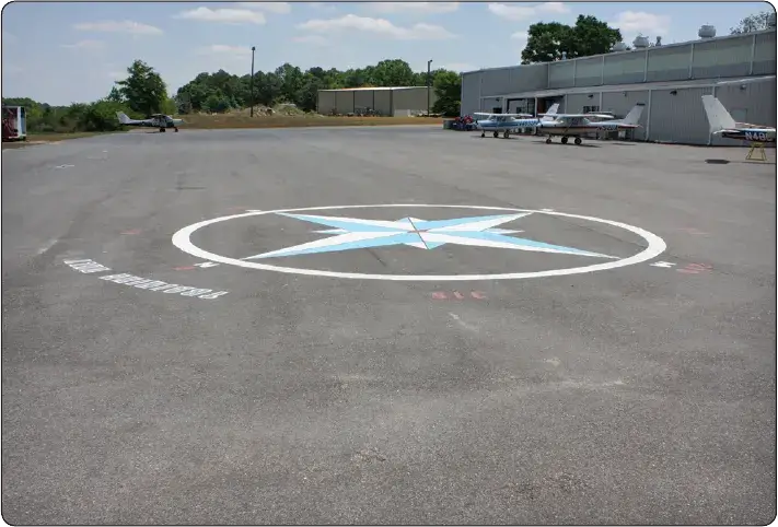 Airport ramp compass rose used to swing and calibrate an aircraft magnetic compass