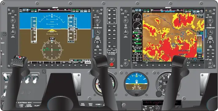 Glass cockpit instrument panel with flat-screen displays and analog airspeed, attitude, and altimeter backups