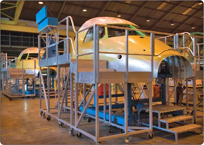 Aircraft being formed and assembled during a factory manufacturing process