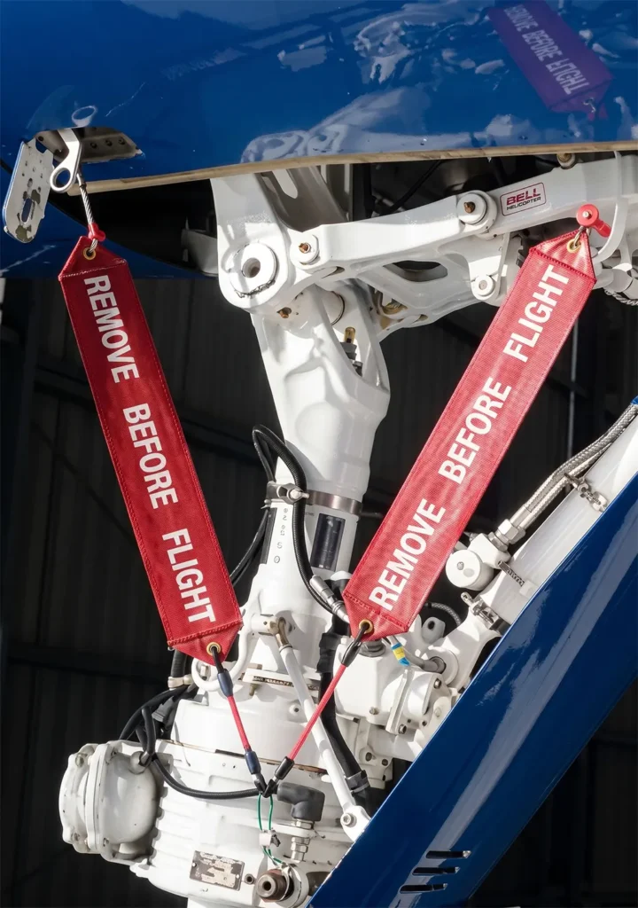 Landing gear ground lock pins installed to secure the gear against unintended retraction during ground operations