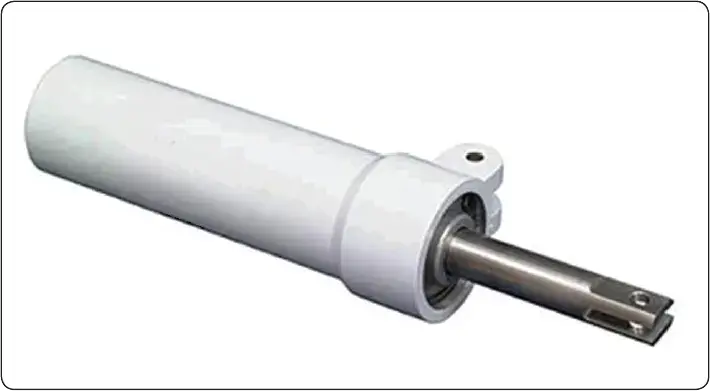 Non-hydraulic shimmy damper with a rubber piston and lubricant providing resistance within the housing