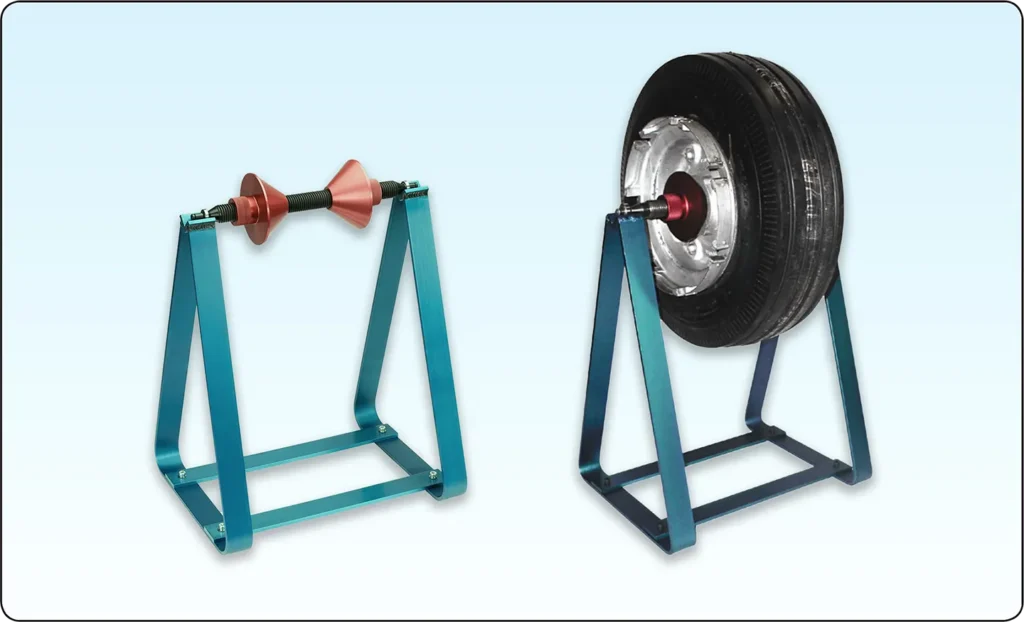 Aircraft tire and wheel mounted on a balancing stand for static wheel assembly balancing