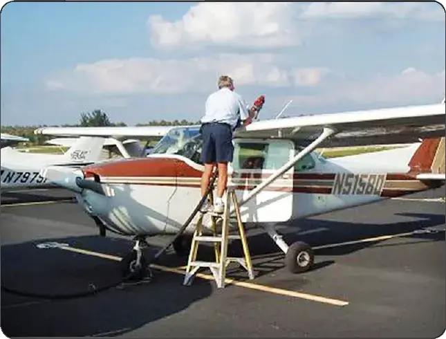 Over-the-wing refueling of a Cessna aircraft using a fueling nozzle at the wing fuel filler