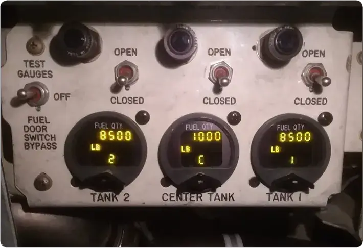 Pressure refueling panel with fuel valve position switches, quantity gauges, and open-position indicator lights for each tank