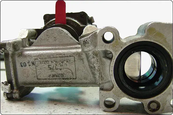 Motor-operated aircraft fuel gate valve with a red position indicator lever for manual valve positioning and maintenance identification