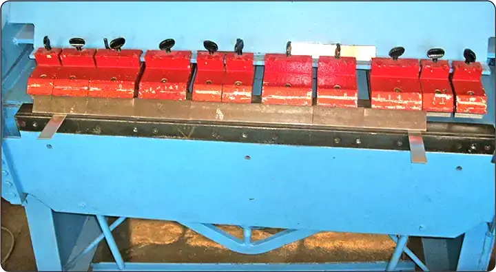 Sheet metal brake alignment checked with two test strips positioned 3 inches from each end