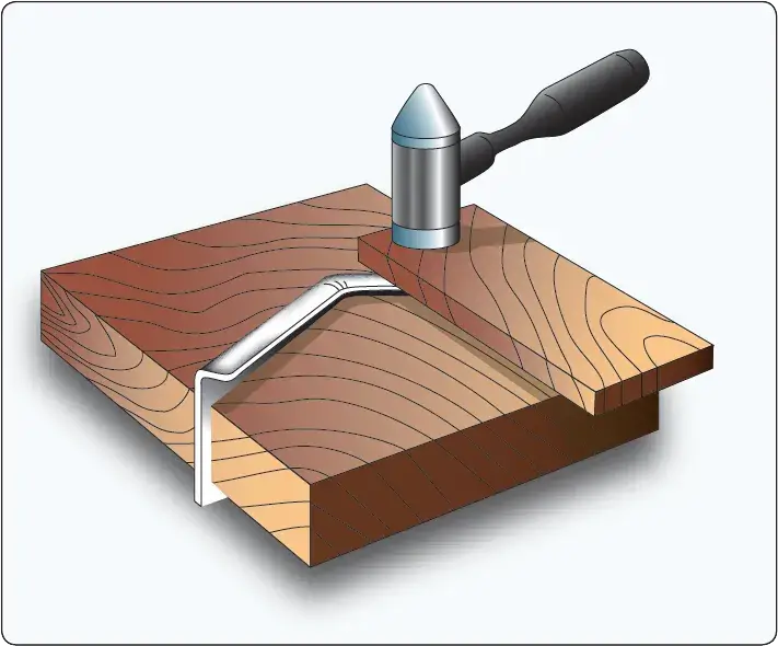 Shrinking technique used to reduce the width of aircraft sheet metal and form curved shapes
