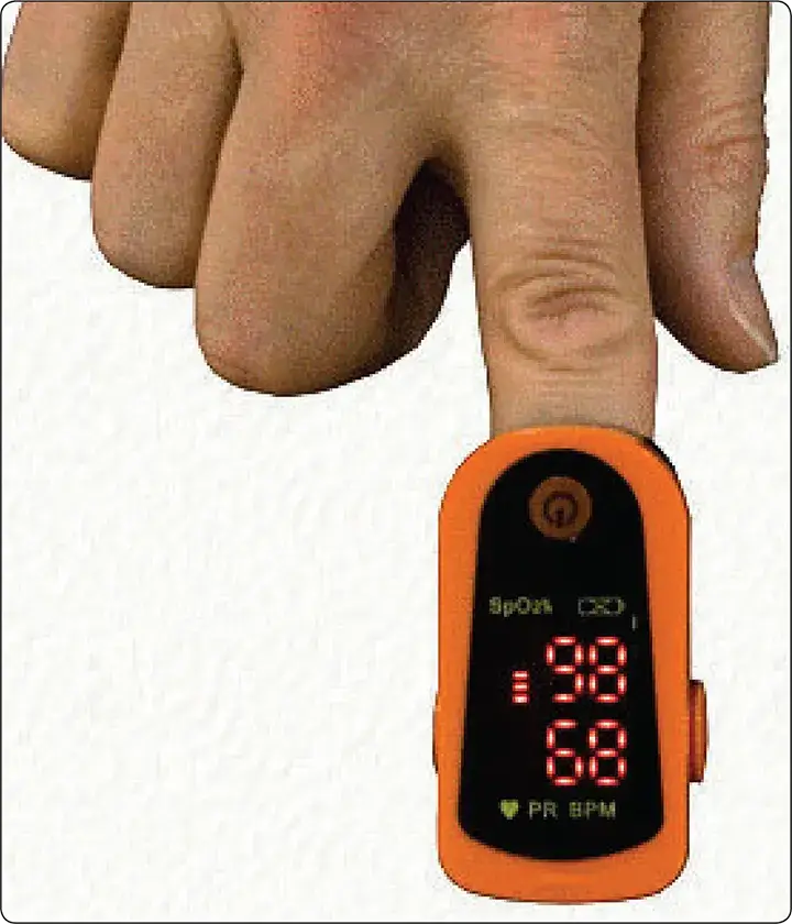 Portable pulse oximeter displaying blood oxygen saturation percentage and heart rate for monitoring oxygenation during flight