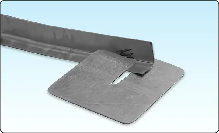 Samples of joggled aircraft sheet metal showing offset steps for overlapping structural components