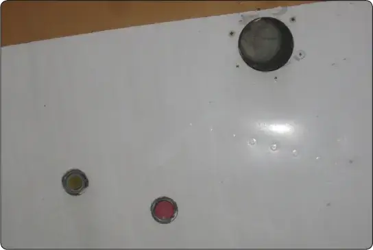 Aircraft fire extinguisher discharge indicators used to show whether a suppression system has been activated