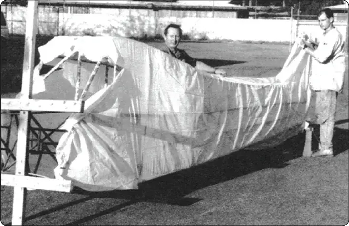 Presewn fabric envelope fitted over an aircraft fuselage using the envelope covering method