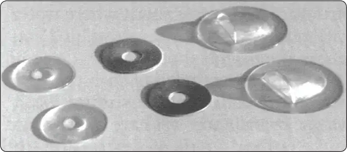Plastic, aluminum, and seaplane grommets reinforcing drain holes in aircraft fabric covering
