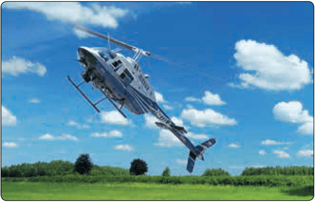 Bell Jet Ranger in final stage of autorotation