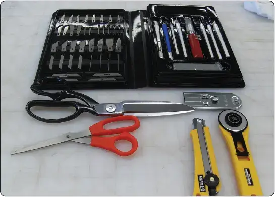 Hand tools used for composite material layup during aircraft structural repair