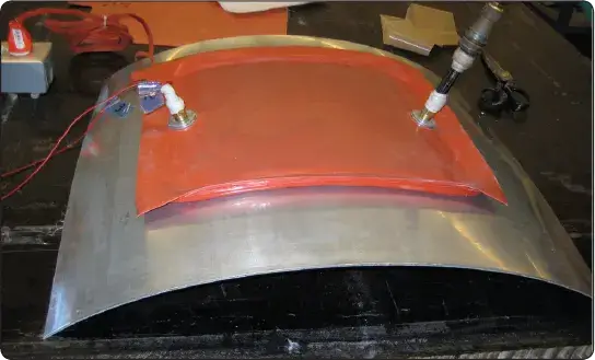 Self-sealing vacuum bag with integrated heater element for curing aircraft composite repairs