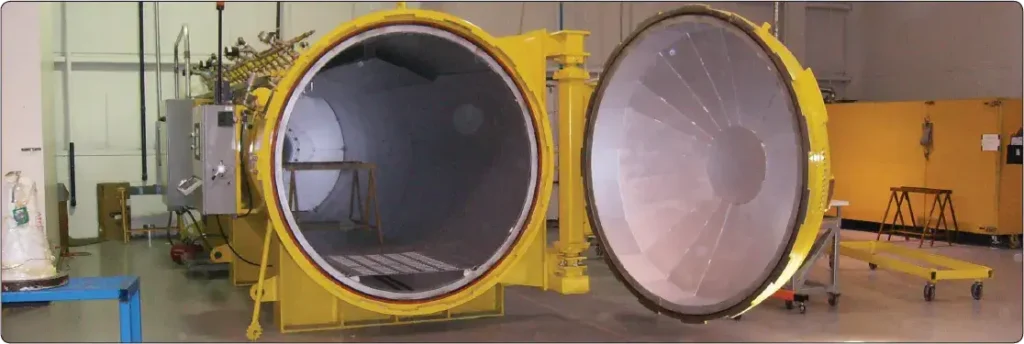 Autoclave used to apply controlled heat and pressure for curing aircraft composite components
