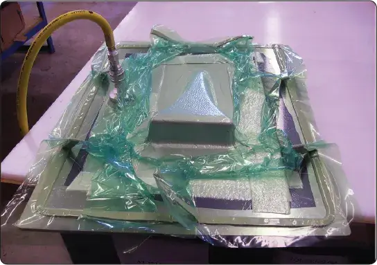 Vacuum bagging of a contoured aircraft composite part during repair or fabrication