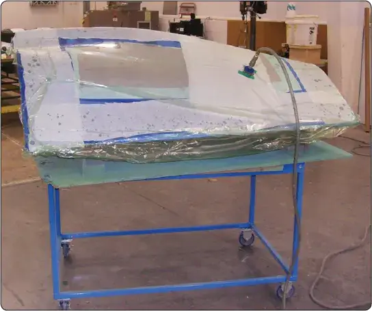 Envelope bagging of an aircraft composite repair for vacuum curing
