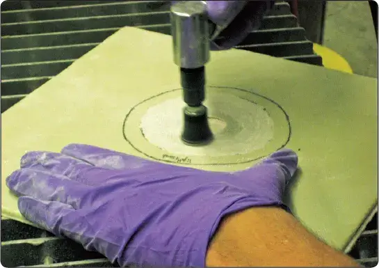 Taper sanding of the repair area on an aircraft honeycomb sandwich structure