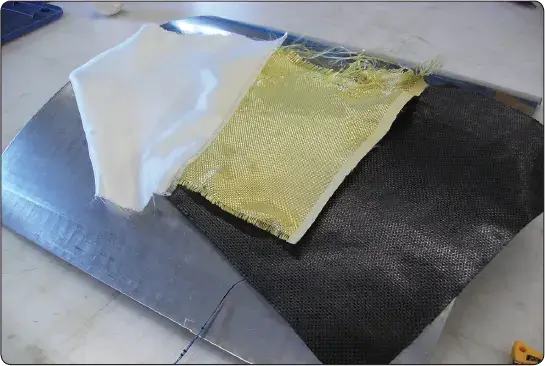 Fiberglass, Kevlar®, and carbon fiber materials used as reinforcement in aircraft composite structures