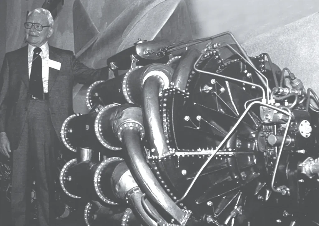 Frank Whittle standing beside the Whittle W-2/200 turbojet engine during early jet engine development