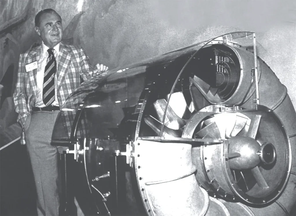 Hans von Ohain standing beside the HeS-3b turbojet engine used to power the Heinkel He 178, an early turbojet-powered aircraft