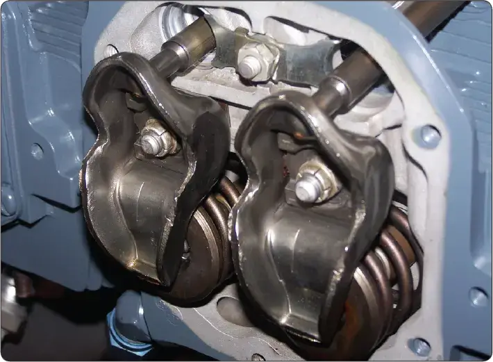 Rocker arms used in the valve-operating mechanism of a horizontally opposed aircraft reciprocating engine