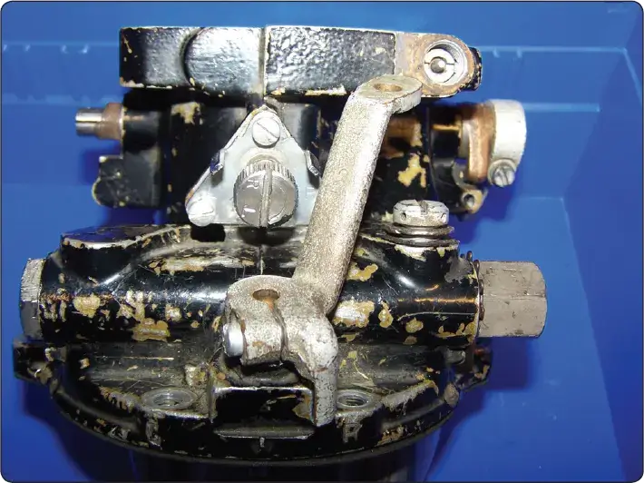 Diagram showing the idle mixture adjustment mechanism on an aircraft engine carburetor