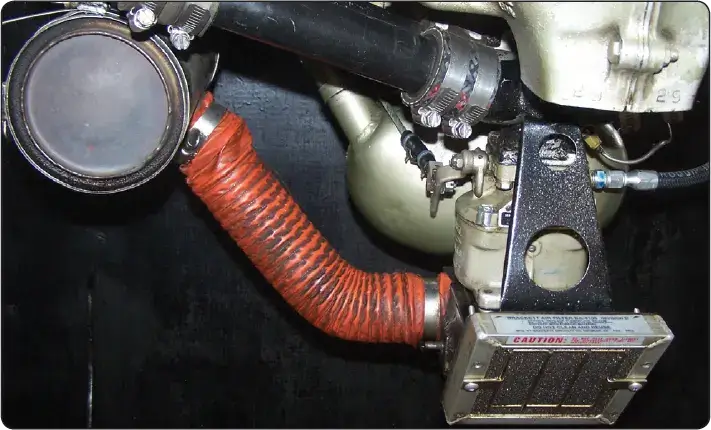 Illustration showing the location of the carburetor heat air valve within an aircraft reciprocating engine induction system