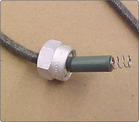 Close-up of the spark plug end of an aircraft ignition lead, showing the connector that attaches to the spark plug