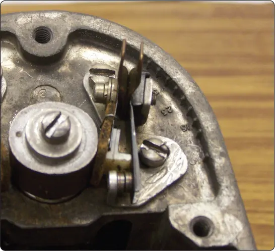 Illustration of a pivotless breaker assembly and cam used to control contact opening and closing in a magneto ignition system