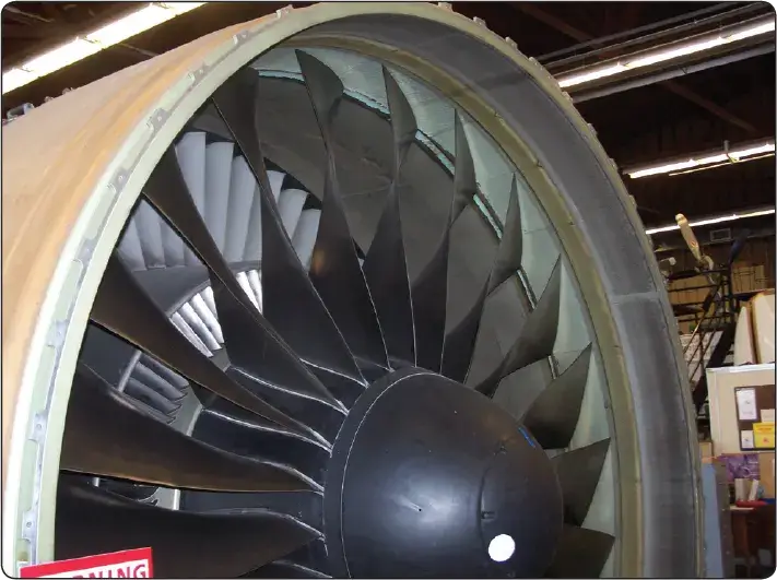 Illustration of a high-bypass turbofan engine fan showing a single stage of rotating blades and stationary vanes