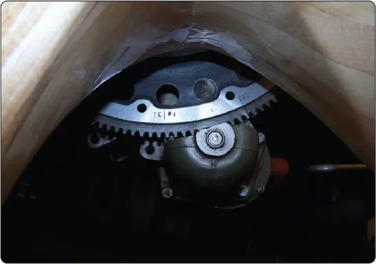 Illustration showing magneto and engine timing marks aligned to establish the correct ignition timing position