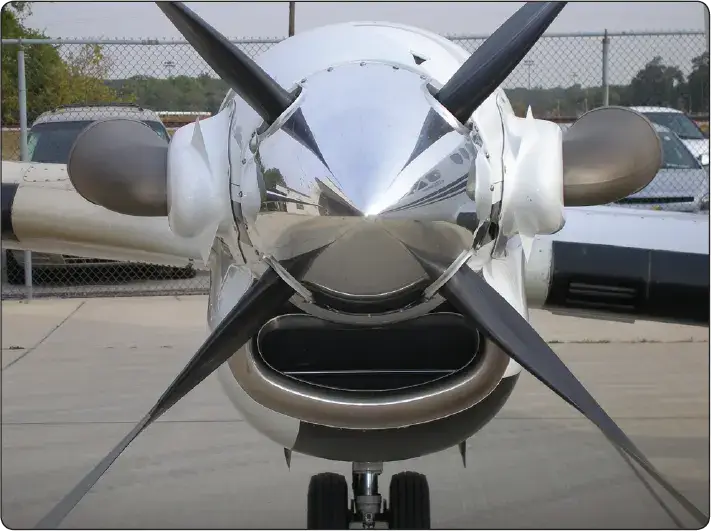 Illustration of a turboprop engine with a ducted inlet arrangement directing airflow into the engine