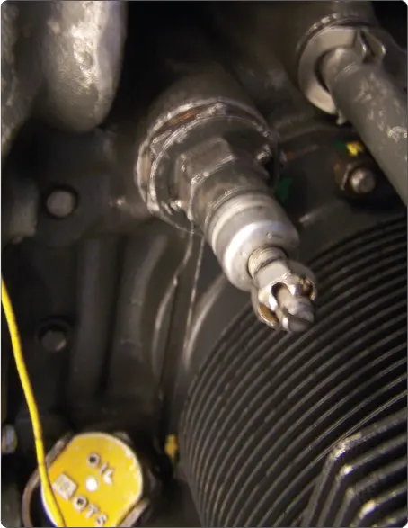 Illustration of an oil pressure adjustment screw used to regulate lubrication system pressure in an aircraft reciprocating engine
