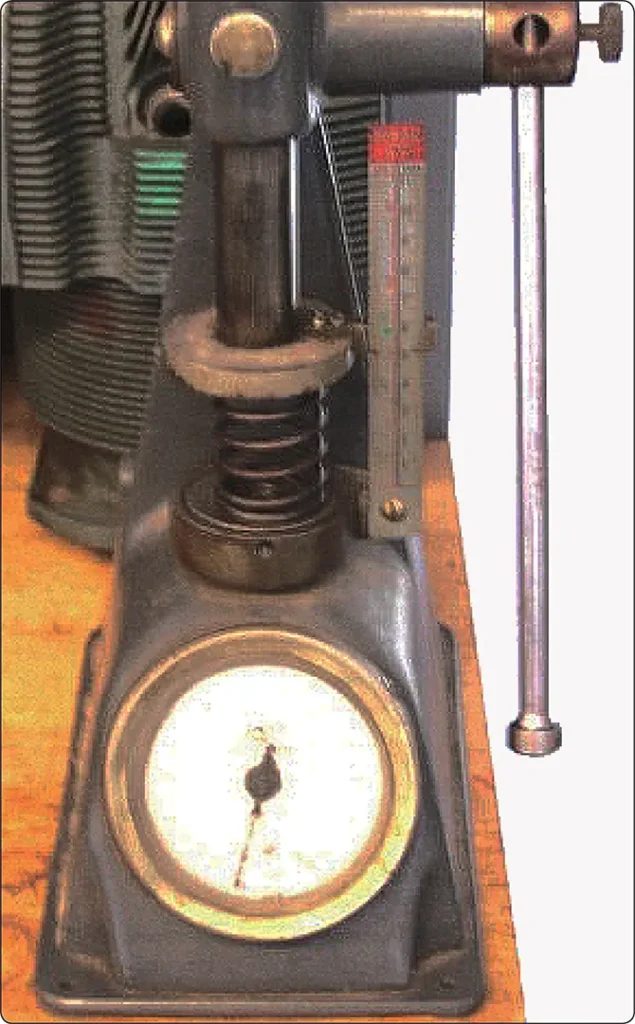 Valve spring compression tester used to measure the force required to compress an engine valve spring during aircraft engine inspection