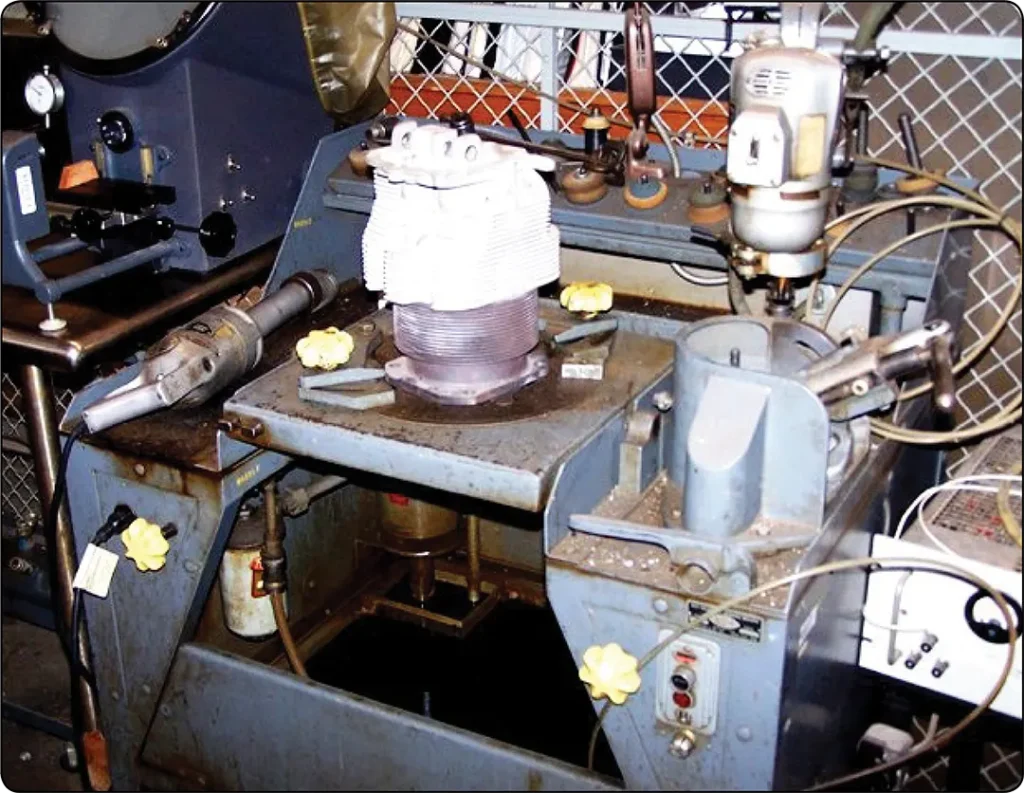 Valve seat grinding equipment used to restore the correct seating surface and angle on an aircraft engine cylinder head during maintenance