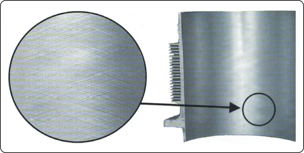 Close-up of an engine cylinder wall showing the crosshatched honing pattern that helps retain lubricating oil and supports proper piston ring seating
