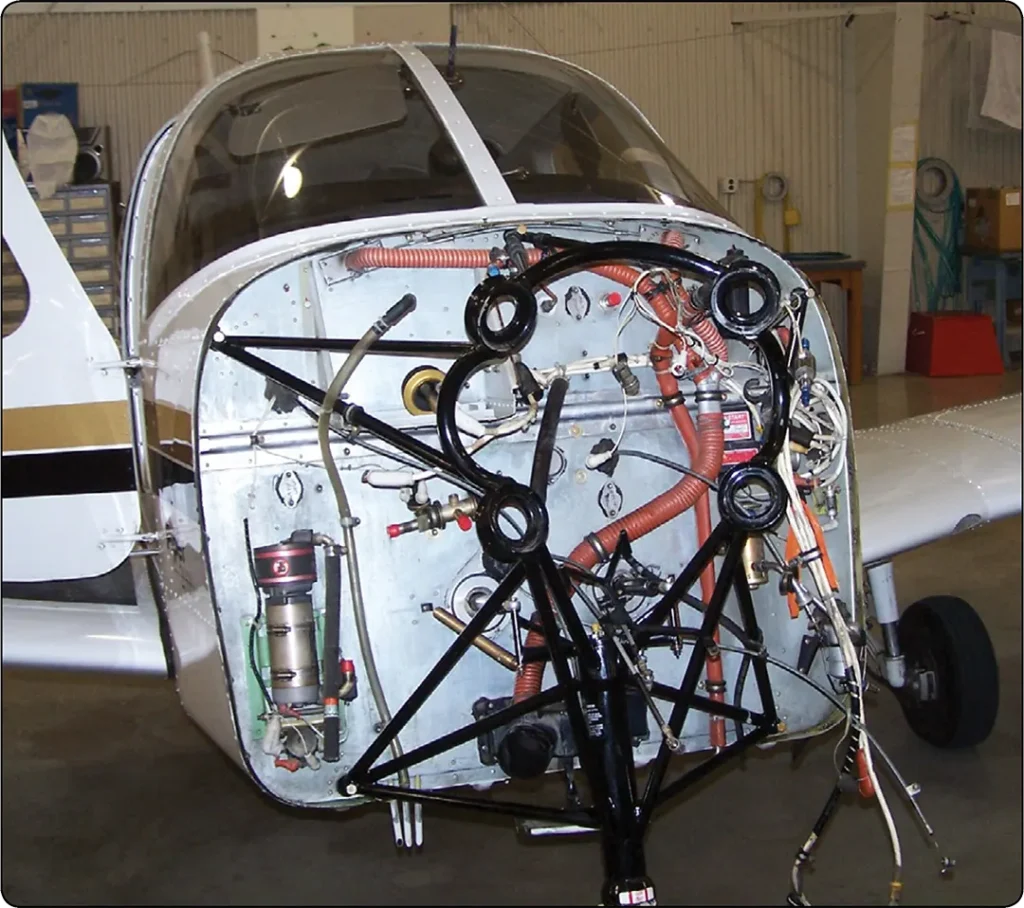 Typical aircraft engine firewall with mounted components and connections separating the engine compartment from the aircraft fuselage